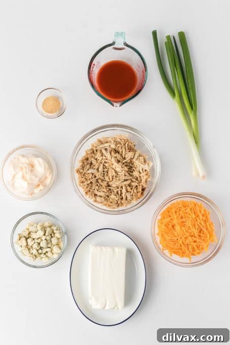 Ingredients for Slow Cooker Buffalo Chicken Dip laid out.