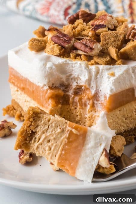 Creamy Pumpkin Dream 3 Beautifully layered No Bake Pumpkin Dream Bars ready to be served, showcasing the different textures.