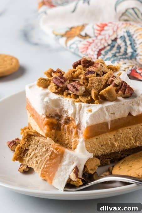 Creamy Pumpkin Dream 10 A slice of the No-Bake Pumpkin Lush with a bite taken out, showing the perfect layering and creamy texture.