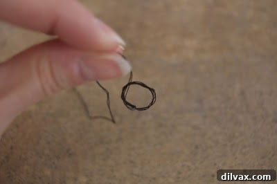 Step 4: Pulling the loop down towards the thread end.