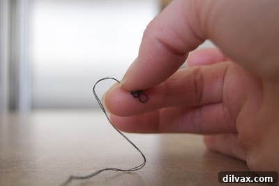 Step 5: Tightened knot at the end of the thread.