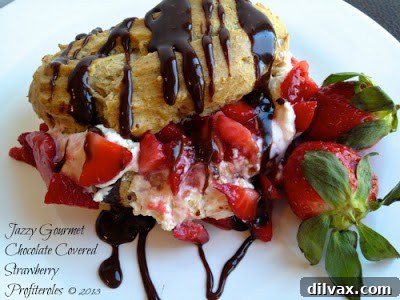 Exquisite chocolate covered strawberry profiteroles, elegantly presented.