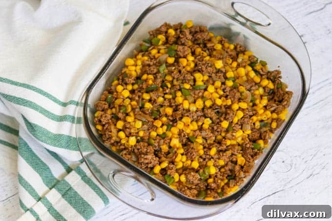 The beef and corn layer of an Easy Shepherd's Pie Recipe. The beef and corn layer of an Easy Shepherd's Pie Recipe.
