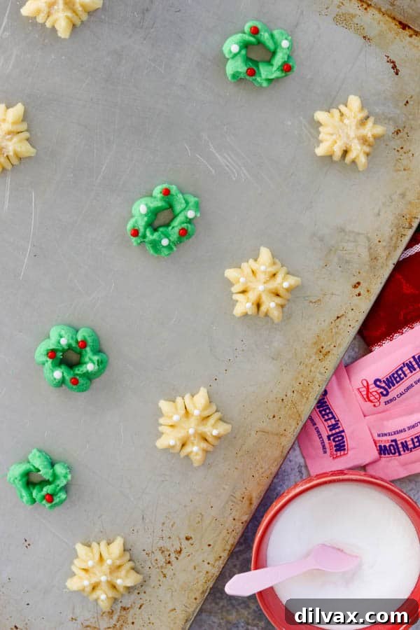 Spritz cookie dough on a baking sheet and ready to be baked. Spritz Cookies ready for the oven.