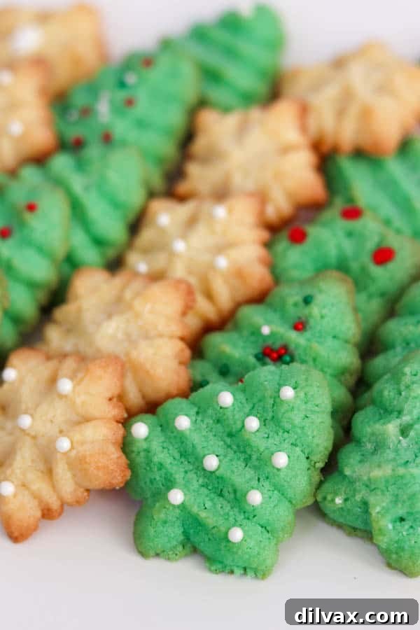 Baked Spritz Cookies - green trees and snowflakes. Baked Spritz Cookie recipe.