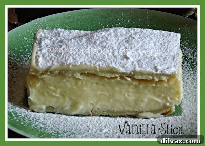 Delicious Vanilla Slice with a creamy filling and dusting of icing sugar.