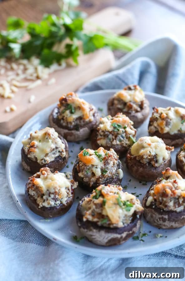 These easy and delicious Cheesy Sausage Stuffed Mushrooms are an appetizer you need to add to your next party. Cheesy Sausage Stuffed Mushrooms.