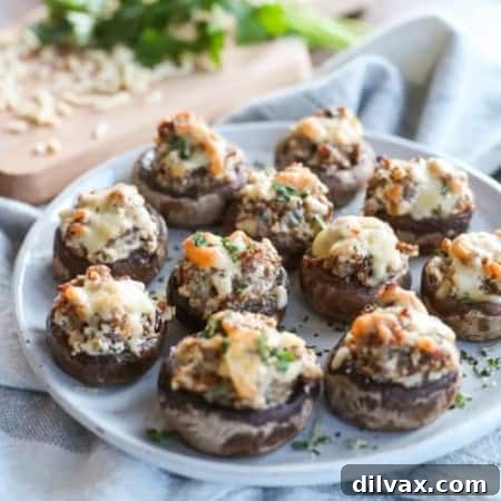 Cheesy Sausage Stuffed Mushrooms on a plate.
