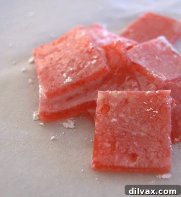 The Secret Recipe for Turkish Delight Revealed 2 Delicious homemade Turkish Delight cubes dusted with powdered sugar, ready to be enjoyed.