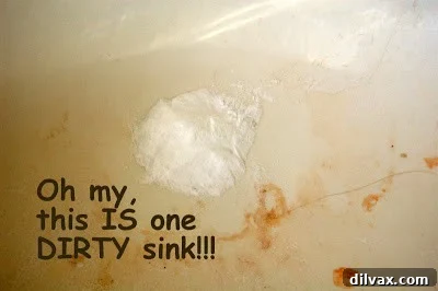 Pouring baking soda powder into the sink drain