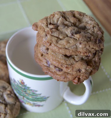 Freshly baked Chocolate Chip Caramel Peanut Butter Pretzel Cookies on a cooling rack.