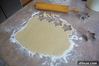 Various shapes of pumpkin spice white chocolate cookies.