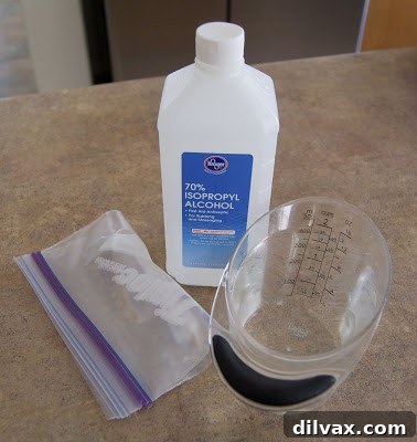 Two Ziploc bags, one filled with ice and water, resting on a surface, illustrating a typical homemade ice pack setup before it leaks.
