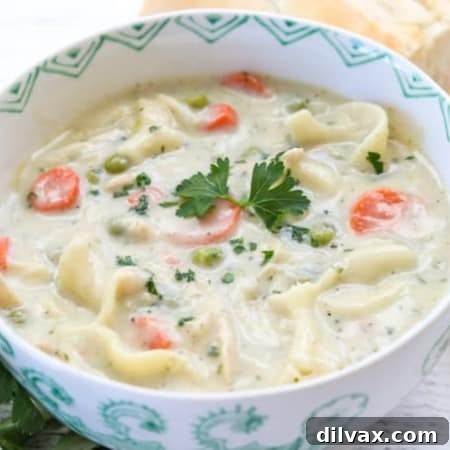 This creamy Homemade Chicken Noodle Soup recipe with chicken, noodles, peas and carrots is a flavorful dish that is super easy to make.