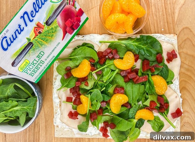 All the vibrant ingredients, including Aunt Nellie's Diced Pickled Beets, laid out for crafting a delicious Beet, Turkey, and Cheese Wrap.