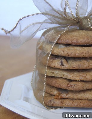 Delicious Triple Chocolate Toffee Caramel Cookies stacked on a cooling rack.