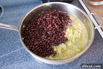 A close-up shot of a single slice of the warm, cheesy Chicken, Black Bean and Tortilla Pie.