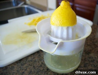 A vibrant yellow and green cup of Del's Frozen Lemonade, an iconic summer treat from Rhode Island.