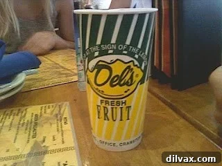 Iconic yellow and green cup of Del's Frozen Lemonade, a Rhode Island tradition.