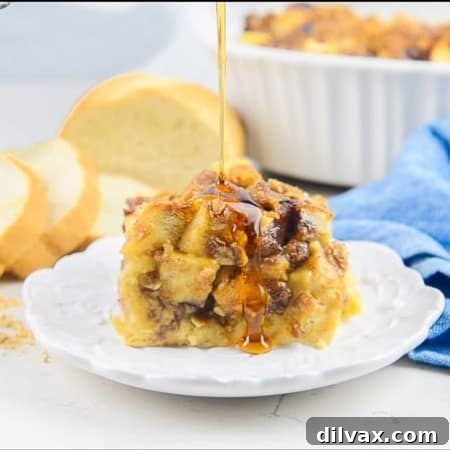 Syrup drizzled on Peanut Butter and Jelly French Toast Casserole.