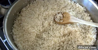 Zesty Cilantro Lime Rice 6 Cooked rice with lime juice being stirred in