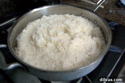 Zesty Cilantro Lime Rice 7 Rice simmering in a covered skillet