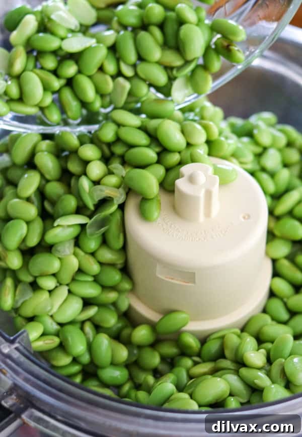 Edamame poured into a food processor.
