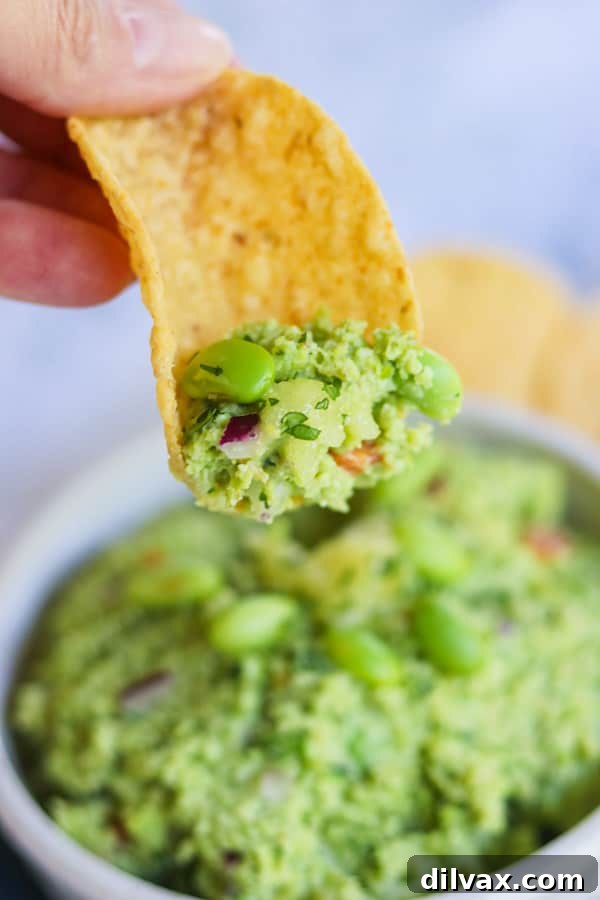 Some guacamole with soybeans on a chip.