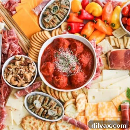 An assortment of meats, cheeses, crackers, nuts, veggies, meatballs and more perfect for snacking, entertaining and dinner!