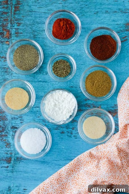 DIY Taco Spice Blend 4 An assortment of vibrant spices, including chili powder, cumin, and paprika, arranged in small bowls ready for blending.