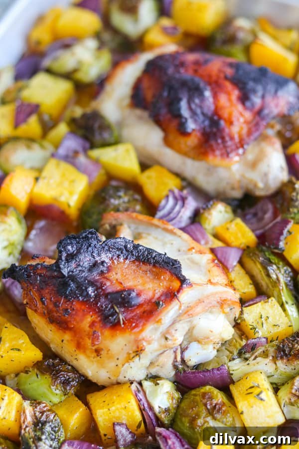 Savory Herb-Roasted Chicken and Vibrant Vegetables 7 Cooked chicken thighs and vegetables served on a platter.