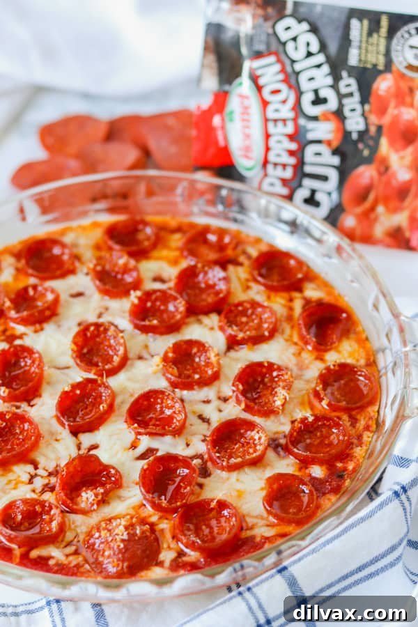 Hot Pepperoni Pizza Dip. Baked Pepperoni Pizza Dip in a pie plate, ready to be served.