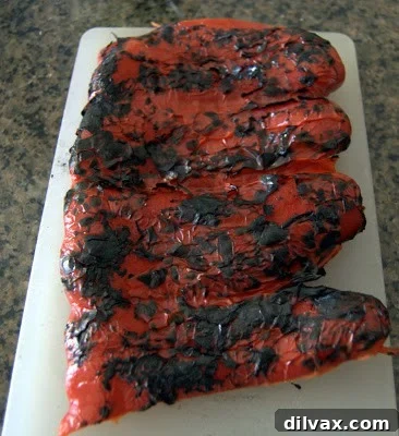 Scraping charred skin off a roasted red pepper