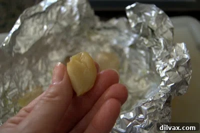 Roasted garlic cloves being extracted