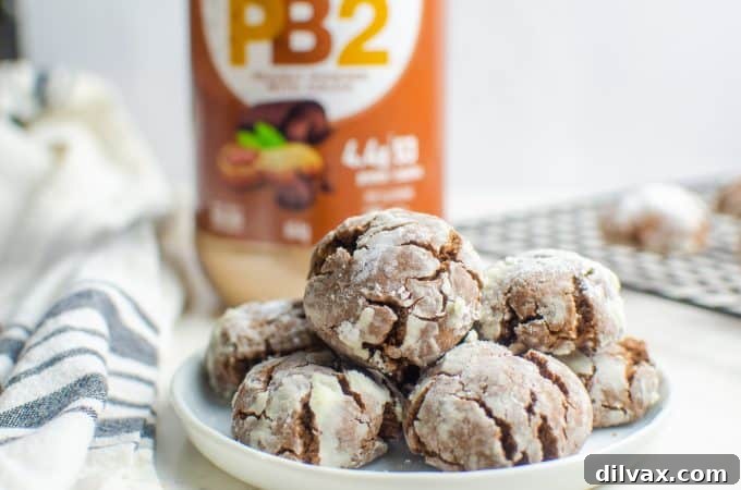 Peanut Butter Chocolate Cookies Delicious Peanut Butter Crinkle Cookies arranged on a plate, showcasing their inviting texture.
