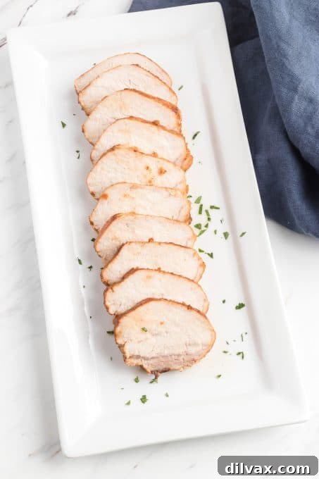 Roasted Pork Tenderloin, perfectly cooked and ready to be sliced