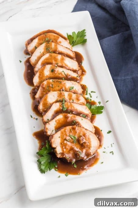 Plated Jack Daniel's Pork Tenderloin with side dishes