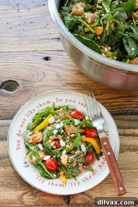 Close-up of Couscous Chicken Salad in a bowl, showing the vibrant colors and textures.