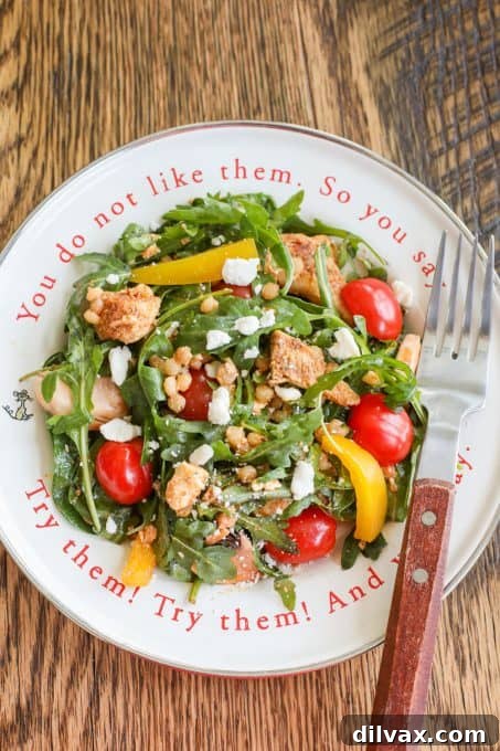 A bowl of Couscous Salad with Chicken, ready to be served.