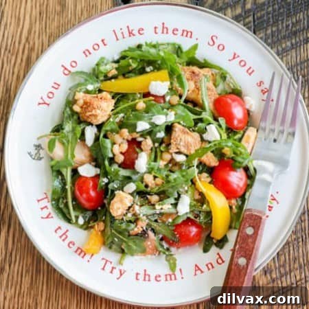 A plate of salad with pearl couscous and chicken.