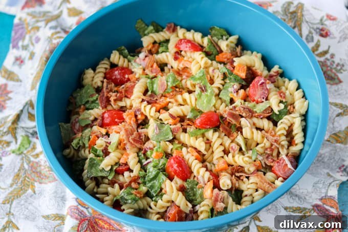 A bowl full of pasta salad, showcasing its vibrant ingredients.