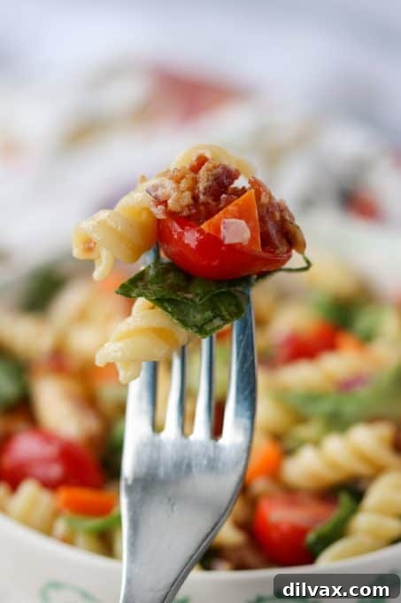 A forkful of Ranch BLT Pasta Salad, ready to be enjoyed.
