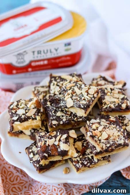 Silken Milk Toffee 8 Neatly sliced squares of finished condensed milk toffee, showing off layers of chocolate, almonds, and chewy caramel.