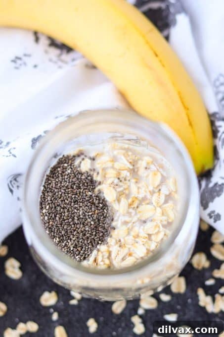A trio of essential ingredients for make-ahead oatmeal: chia seeds, rolled oats, and a ripe banana.