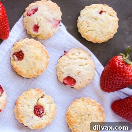 A tray of delectable strawberry, cream cheese, and lemon zest scones, beautifully baked and ready for serving.