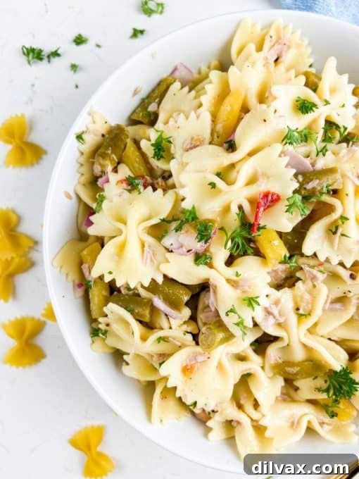 Pasta salad with tuna, 4-bean salad, red onion, and parsely.