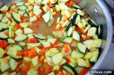 Finished creamy vegetable risotto garnished with herbs