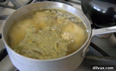 Cooked chicken breasts resting in a saucepan