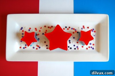 A slice of the 7-layer Red, White, and Blue Jello, showing the intricate layers.