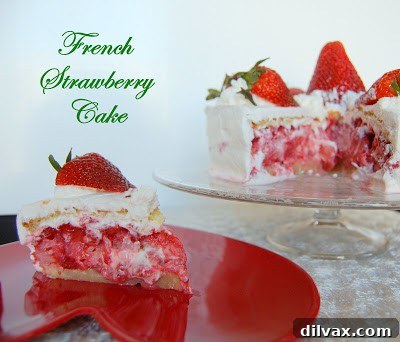 A slice of French Strawberry Cake on a plate, revealing its perfect layers.